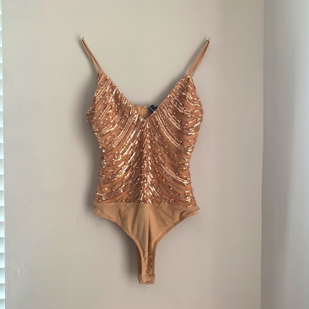 Cute and classic rose gold/ cream one piece suit brand new never been worn.